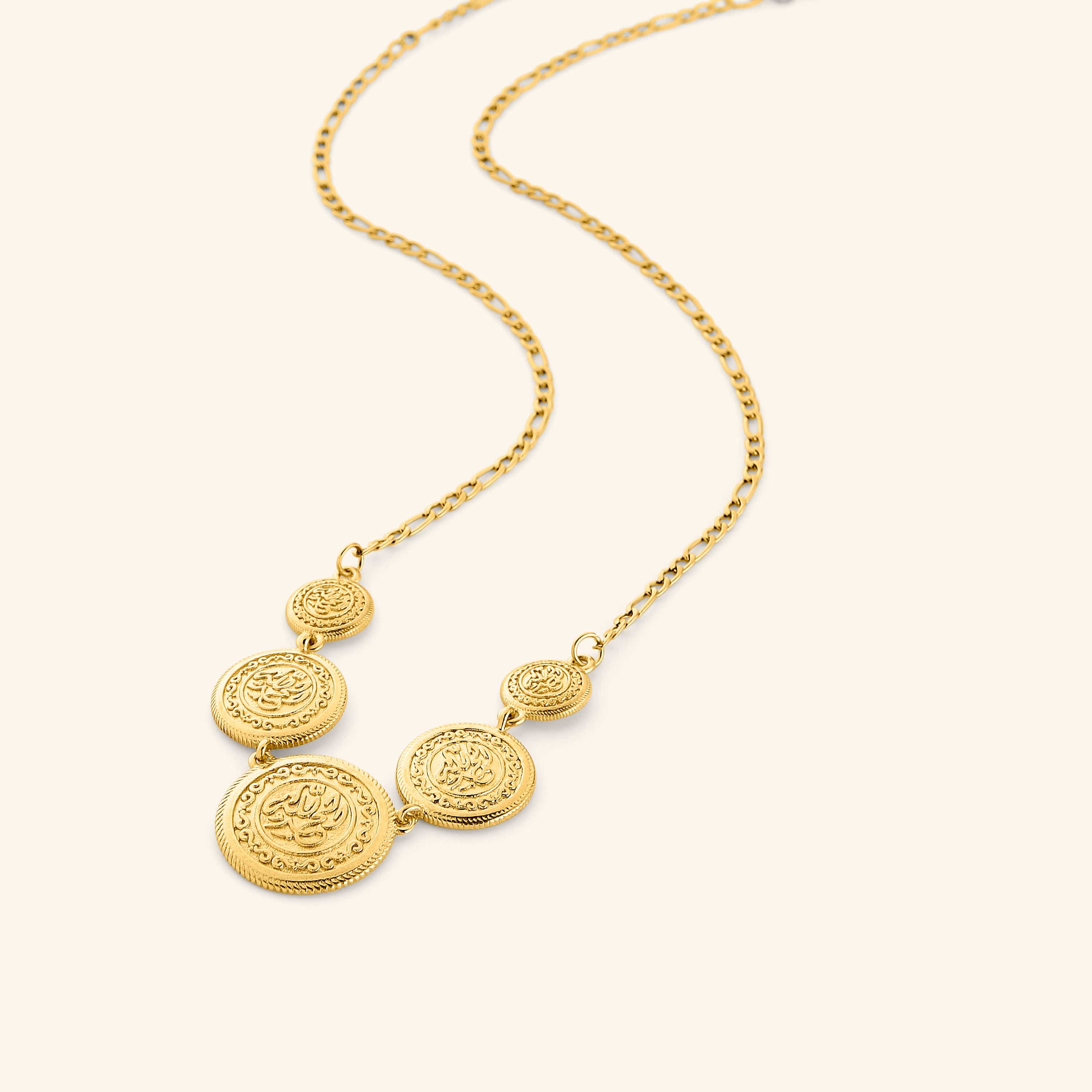 18k gold plated necklace featuring a chain that is strung with coins stamped with الحمد لله (all praise is due to God). Gold coins are layered at varying sizes so they sit asymmetrically
