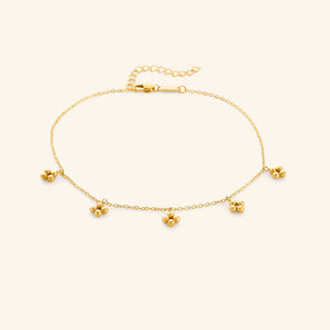 Close-up of the Henna Choker in gold with delicate chain and five small clustered bead charms.