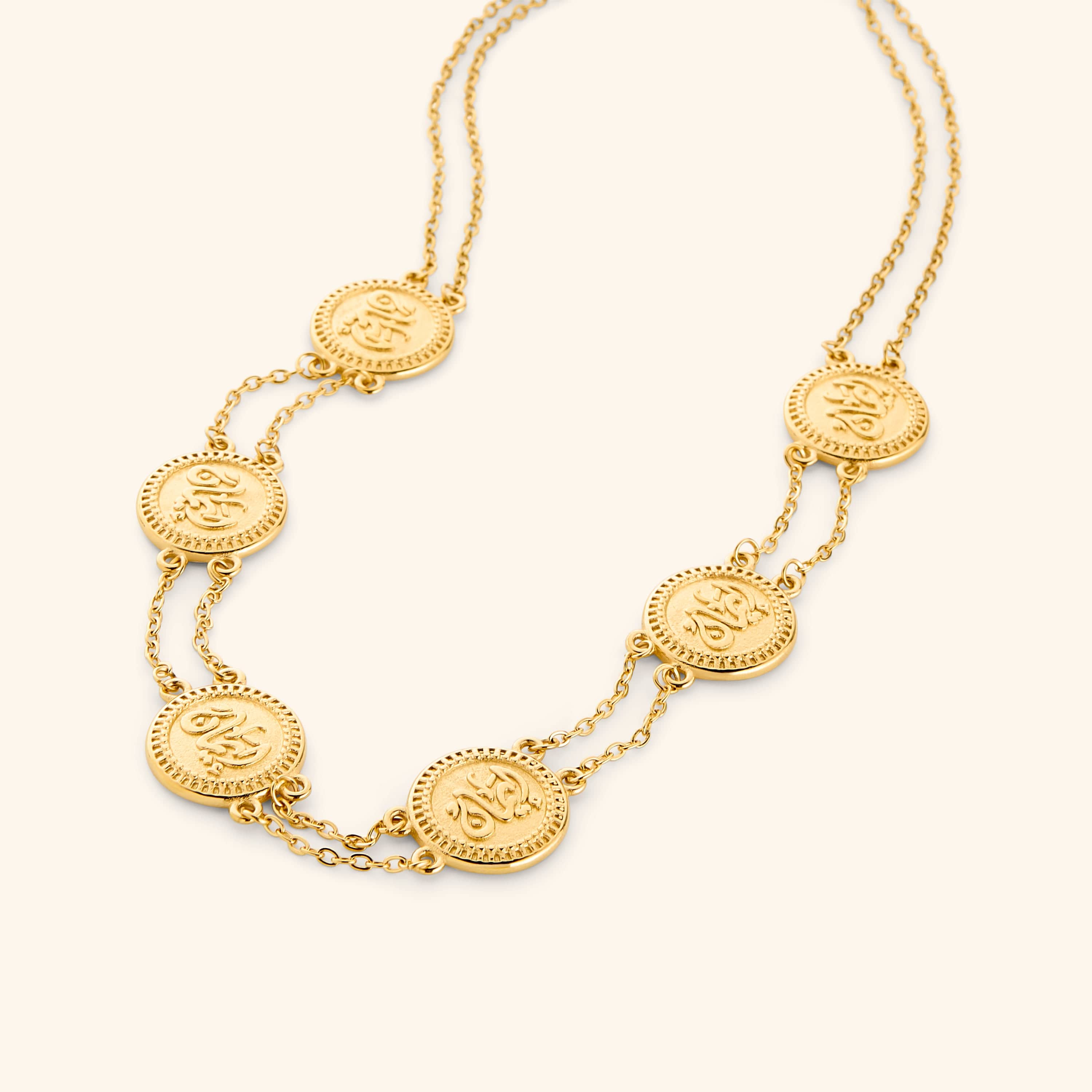 18k gold plated layered necklace strung with coins stamped with إيمان (faith) in Arabic.