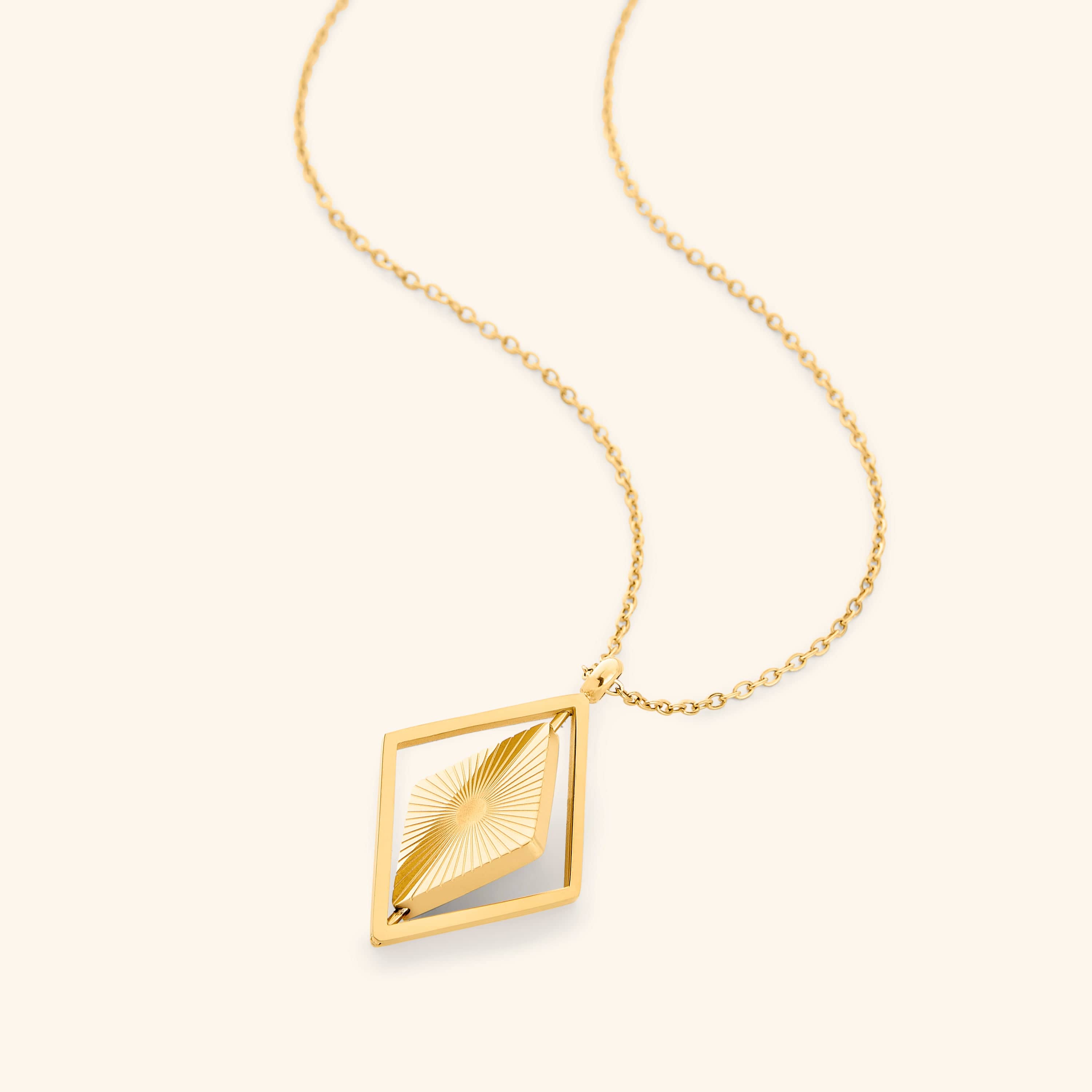 Photo of the gold Sun Rays Necklace against a white background.