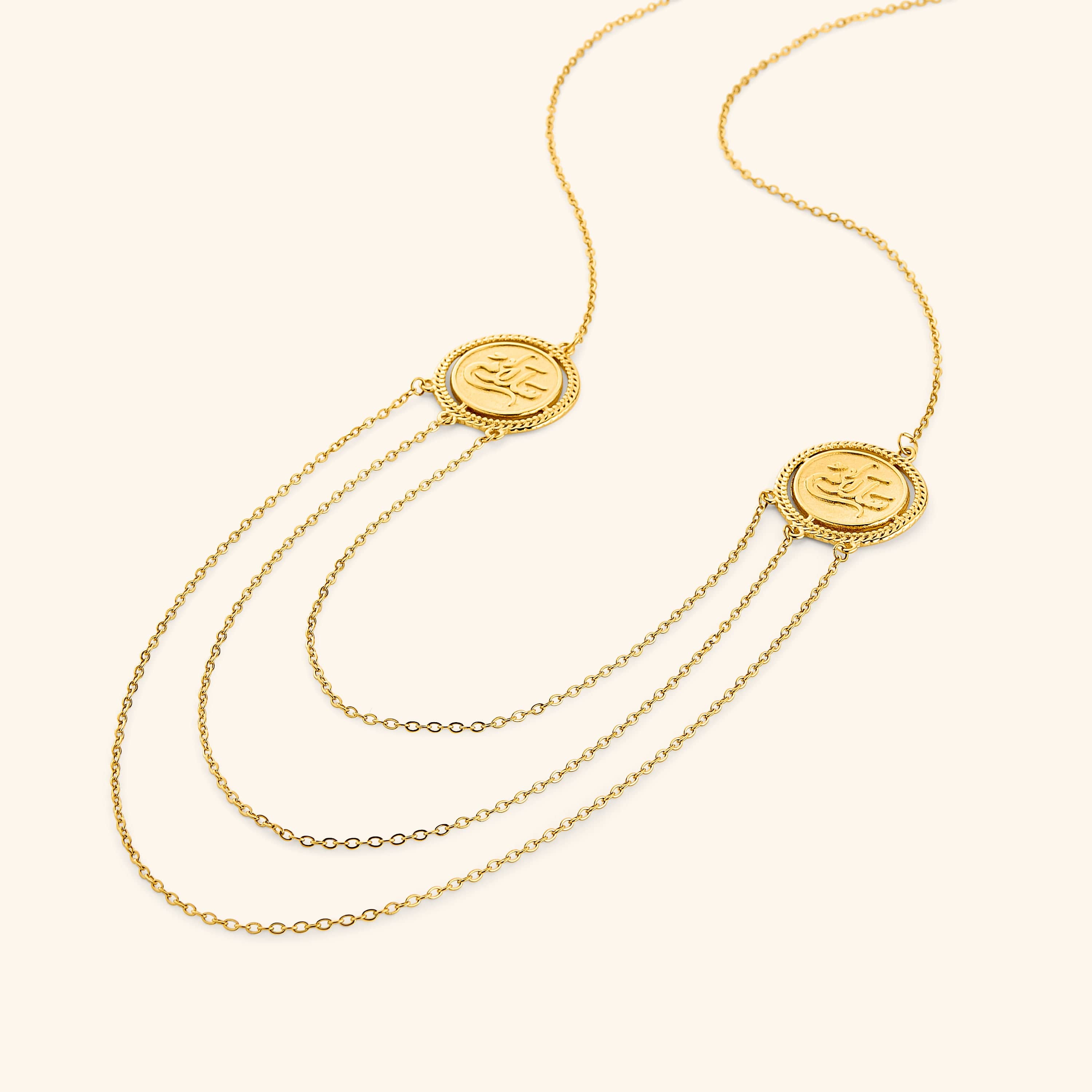 18k gold plated layered necklace featuring three chains of varying lengths connecting two tokens that say Salam (peace in Arabic)
