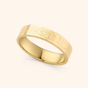Gold band ring engraved with Arabic calligraphy engraved reading “Alhamdulillah”.
