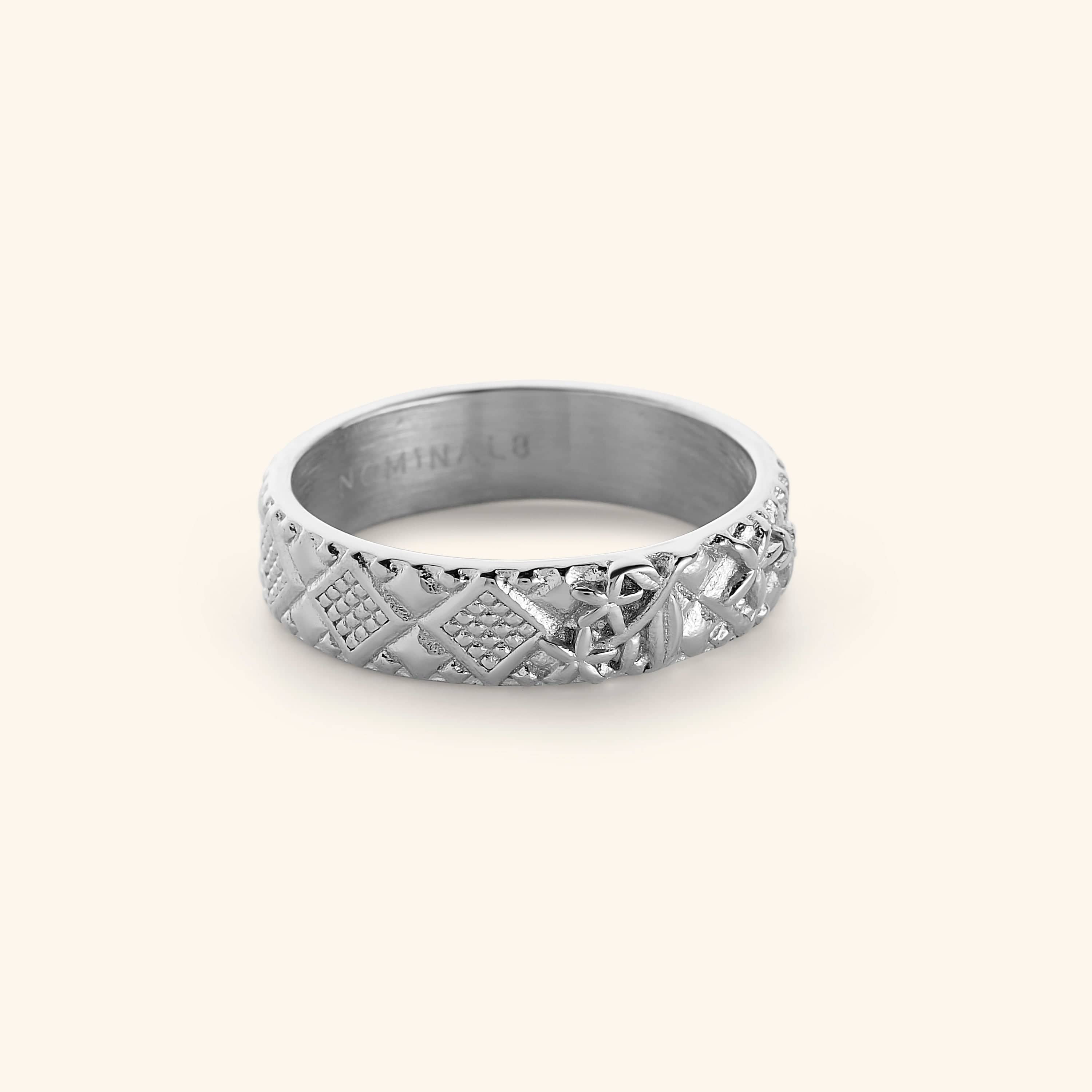 Silver ring featuring patterns found in mosaics of Syria, embossed with Jasmine flower design.
