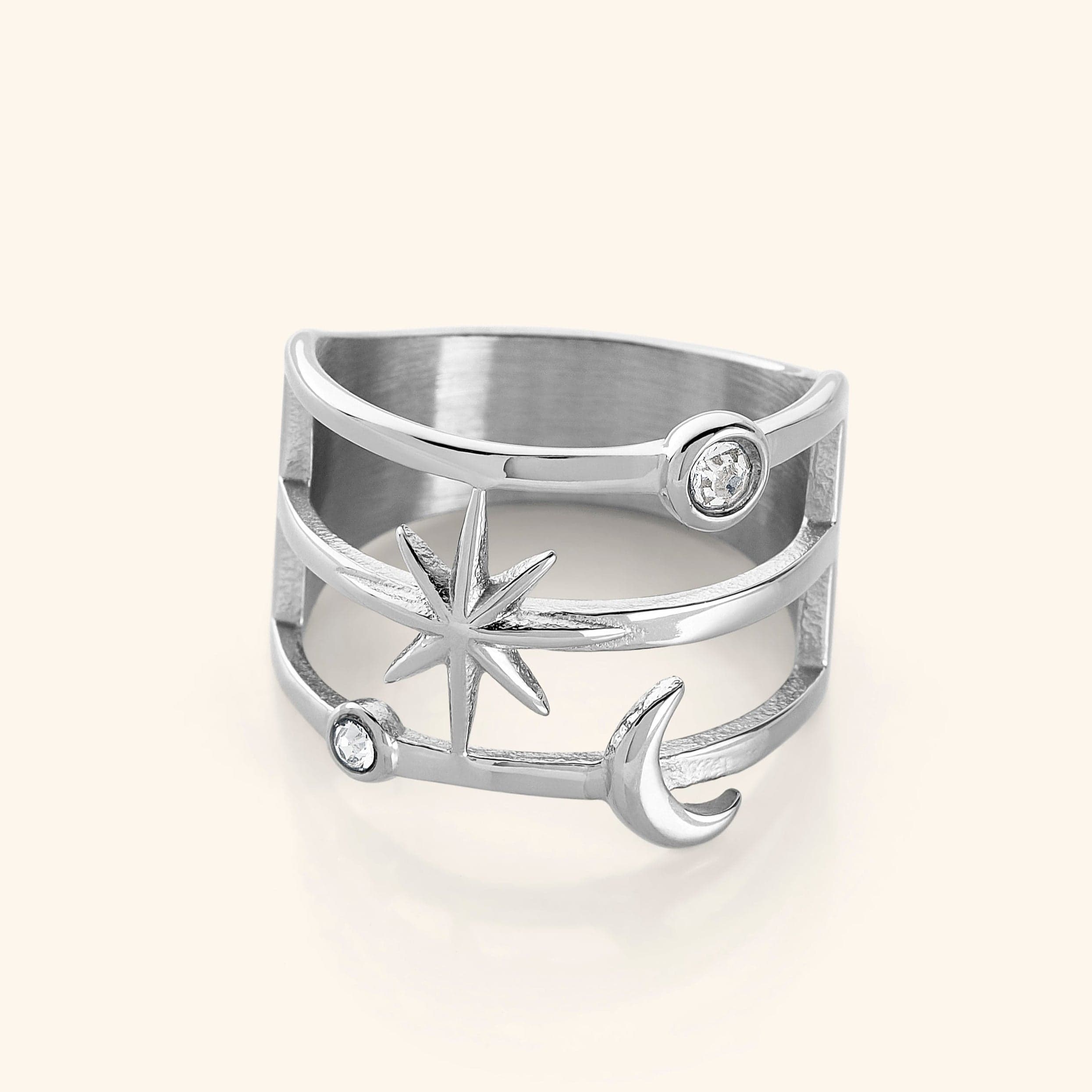 The Galaxy Stack Ring in a polished silver finish, showcasing an openwork design with two luminous bezels, a radiant six-pointed star, and a delicate crescent