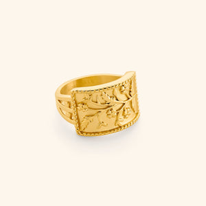 Gold Garden Ring with a rectangular face engraved with delicate floral vines.