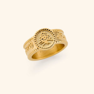 18K gold plated ring with "Freedom is the soul" inscribed in Arabic along the perimeter of its band, leading to a plate that hold the iconic Cedar of Lebanon.