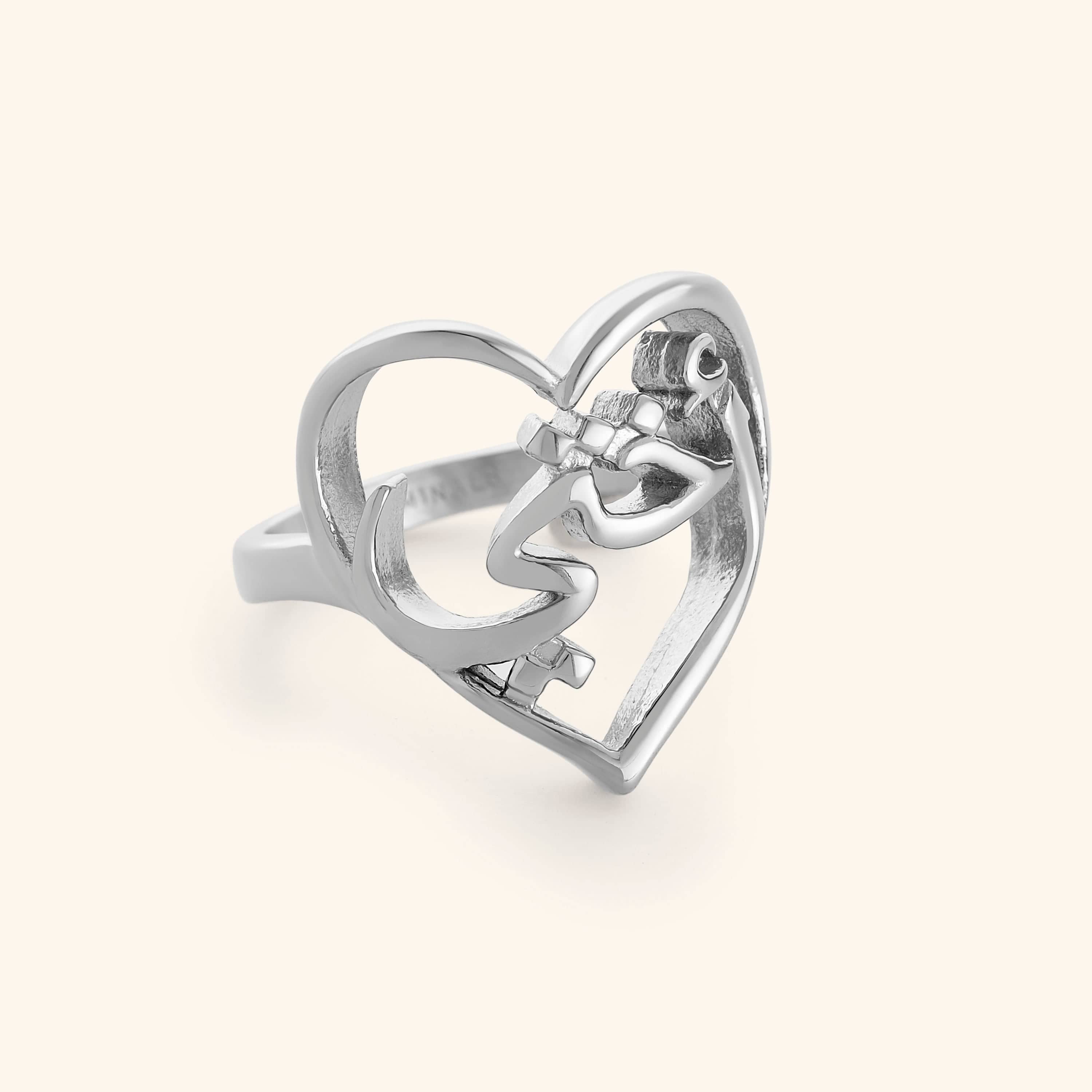 Silver ring with Arabic Calligraphy for "My Sister" wrapped into a heart design.