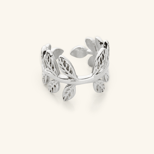 Close-up of a silver Olive Branch Ring with open wrap design, showcasing leaf engravings around the band.