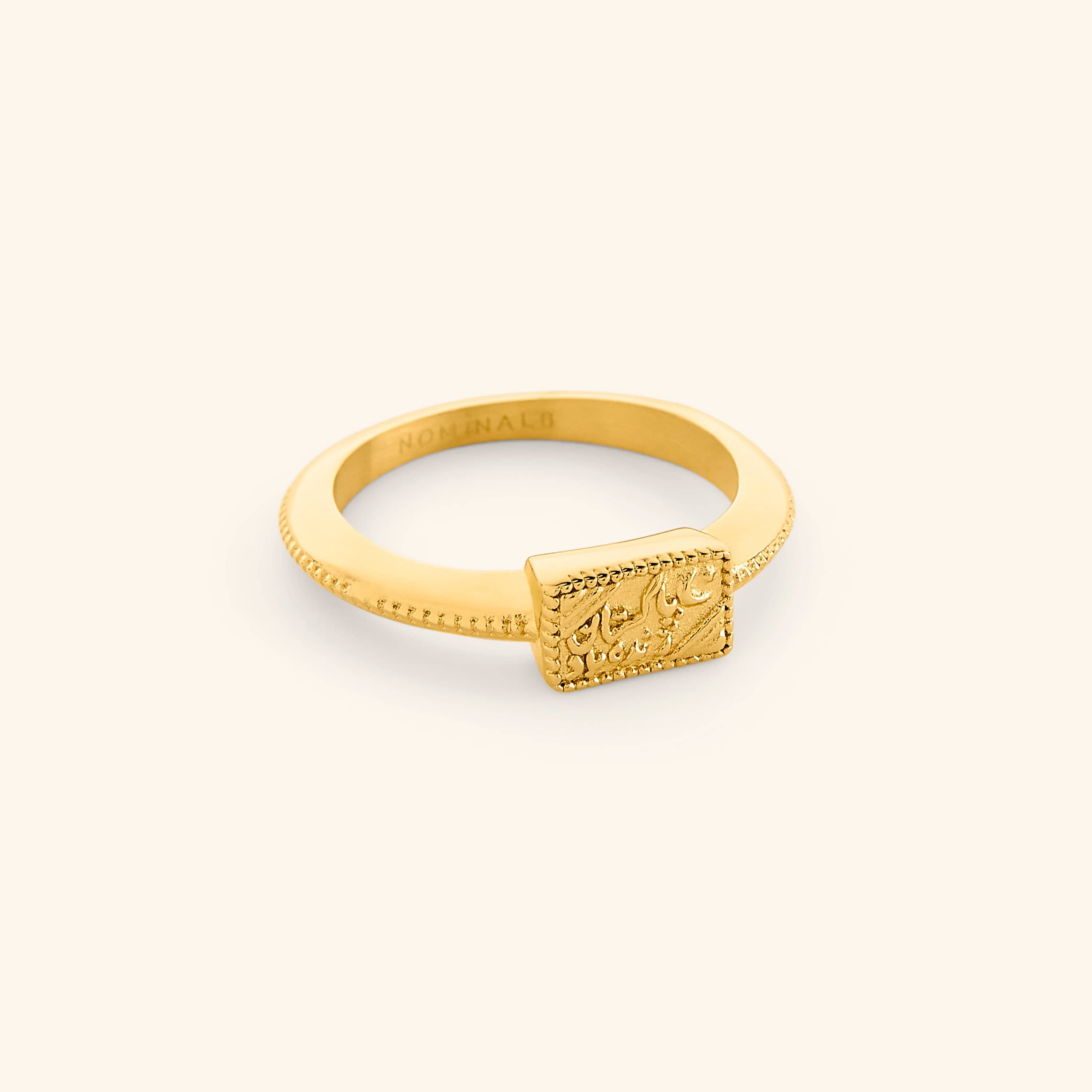 Gold rectangular signet-style ring engraved in Urdu script, reading “Pakistan Zindabad,” with a textured band detail.