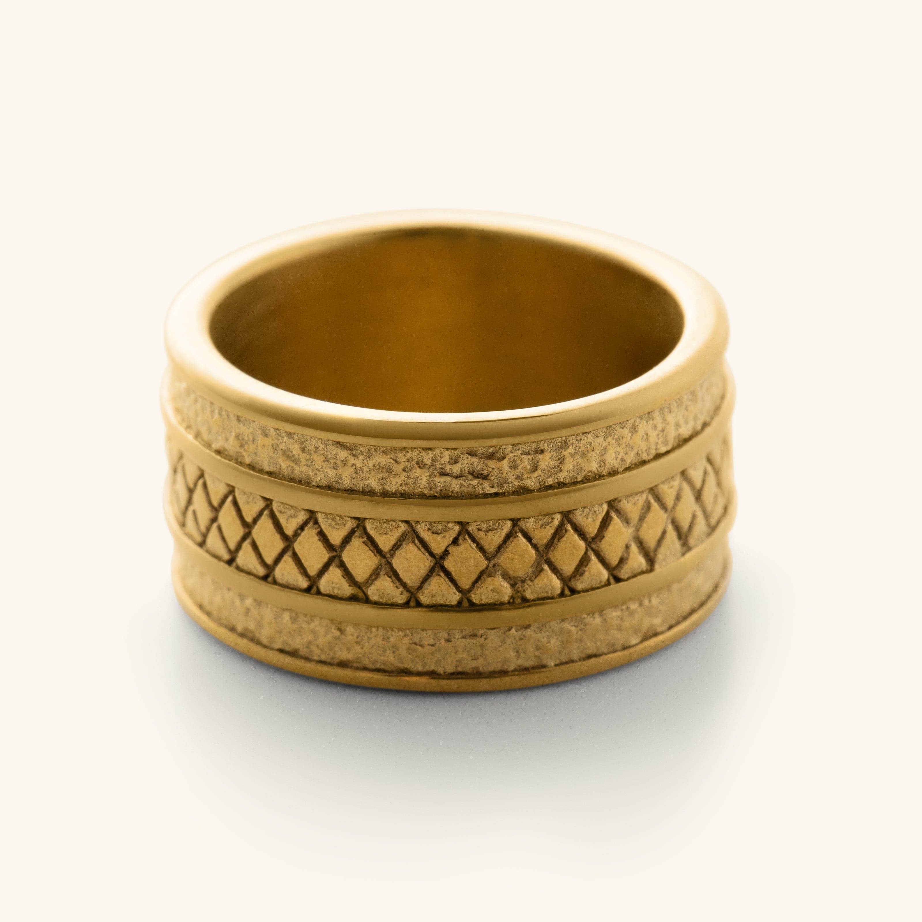 Gold Palestine Tribute Ring featuring a wide band with textured edges and a diamond-patterned center design.
