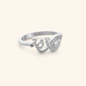 Silver minimal band ring with the word "strength" in Arabic Calligraphy and swirling paisley design. Inside ring engraving reads "Nominal"
