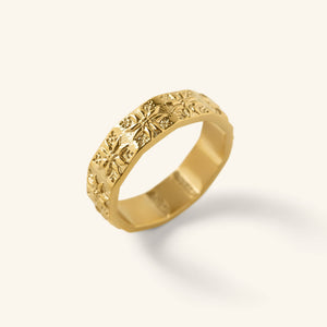 Gold Tatreez Ring with raised tatreez-inspired detailing shown against a neutral background.