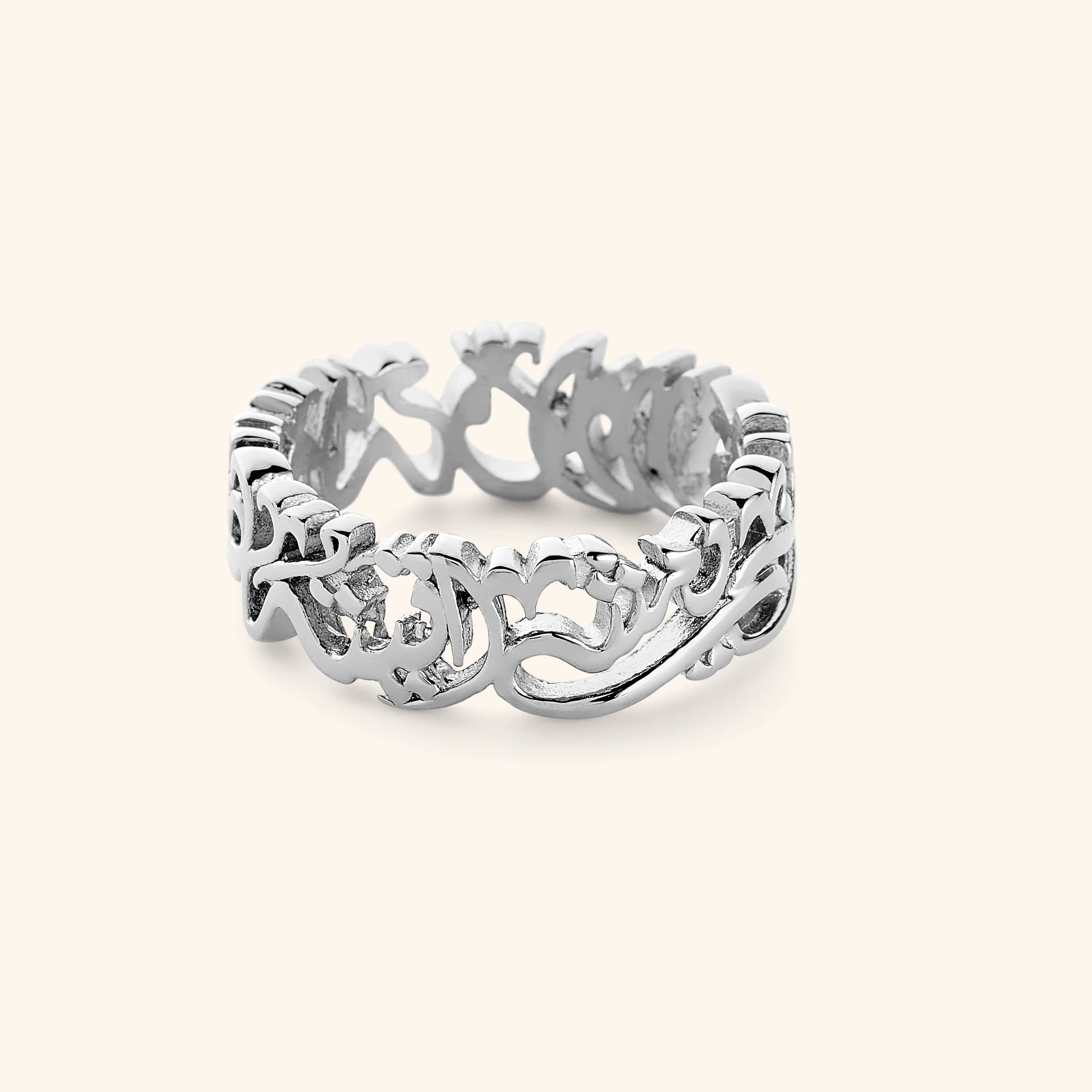 Silver ring with "walk to Me, and I'll run to you" formed from calligraphic Arabic.