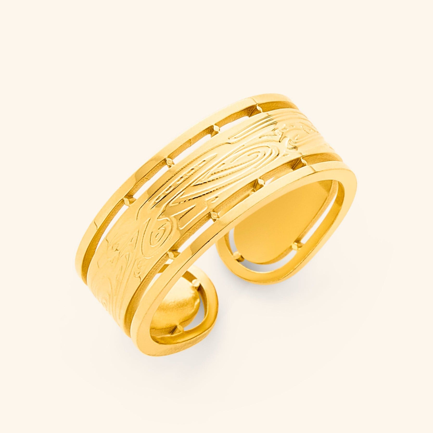 Gold Sabireen ring with intricate Arabic calligraphy and cutout border design, displayed against a neutral background.