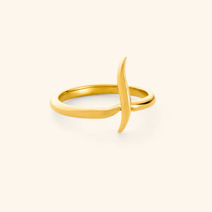 An 18k gold plated ring featuring a single Arabic letter wrapped around a timeless band.